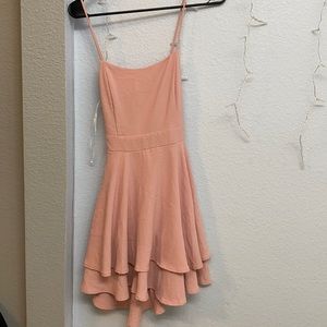 Woman’s pink dress